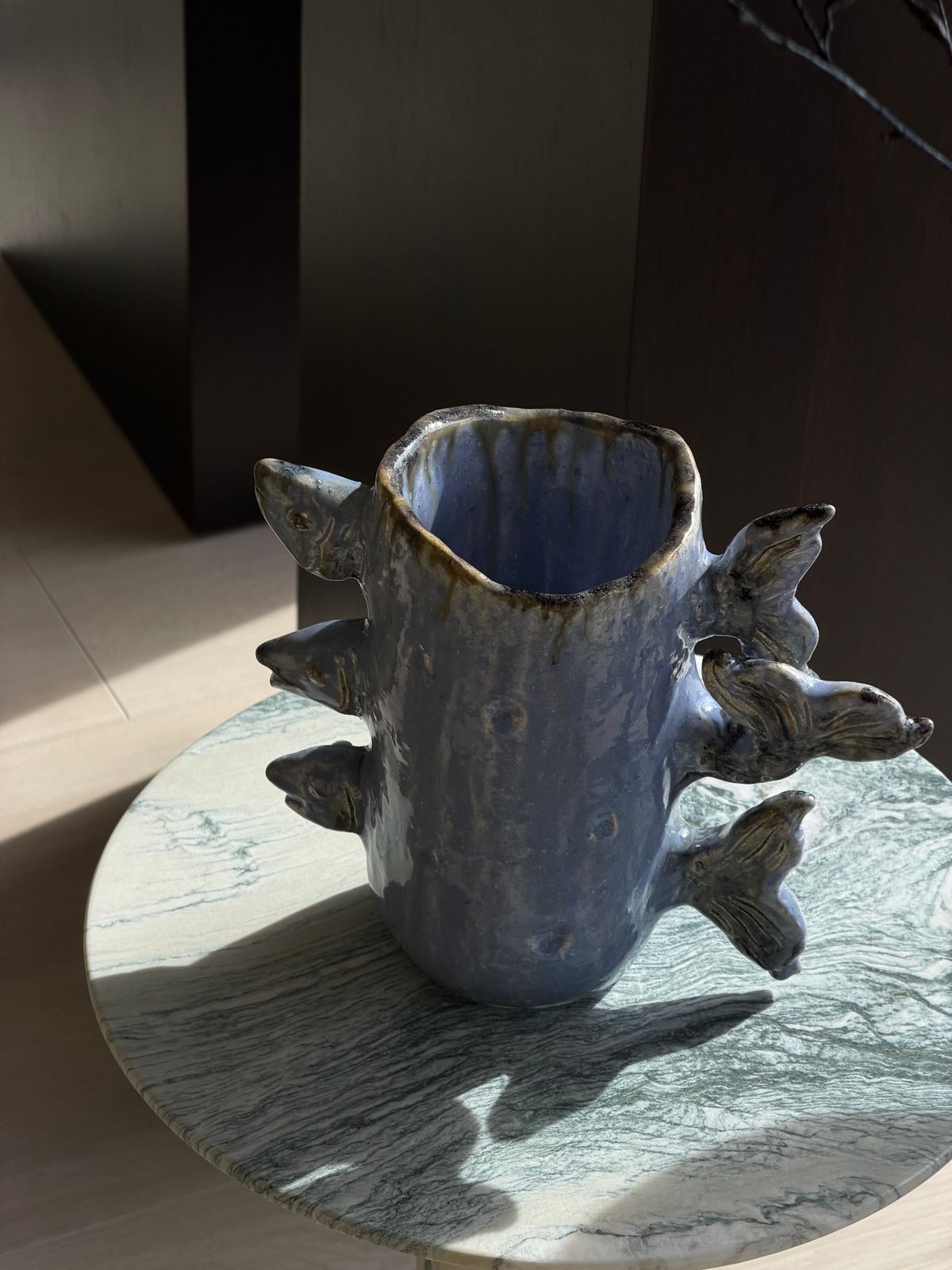 Bonie Pisces Vase — A blue-glazed body with sculptural forms on its sides that recall fish fins.
