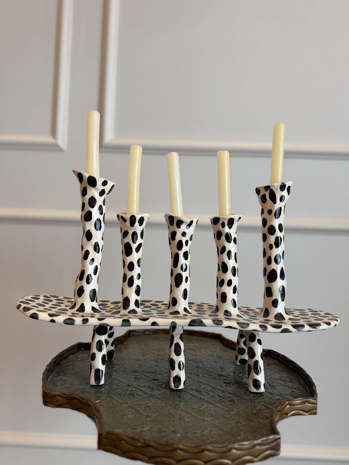 Dalmatian Candelabra — A five-arm ceramic candelabra with black spots.