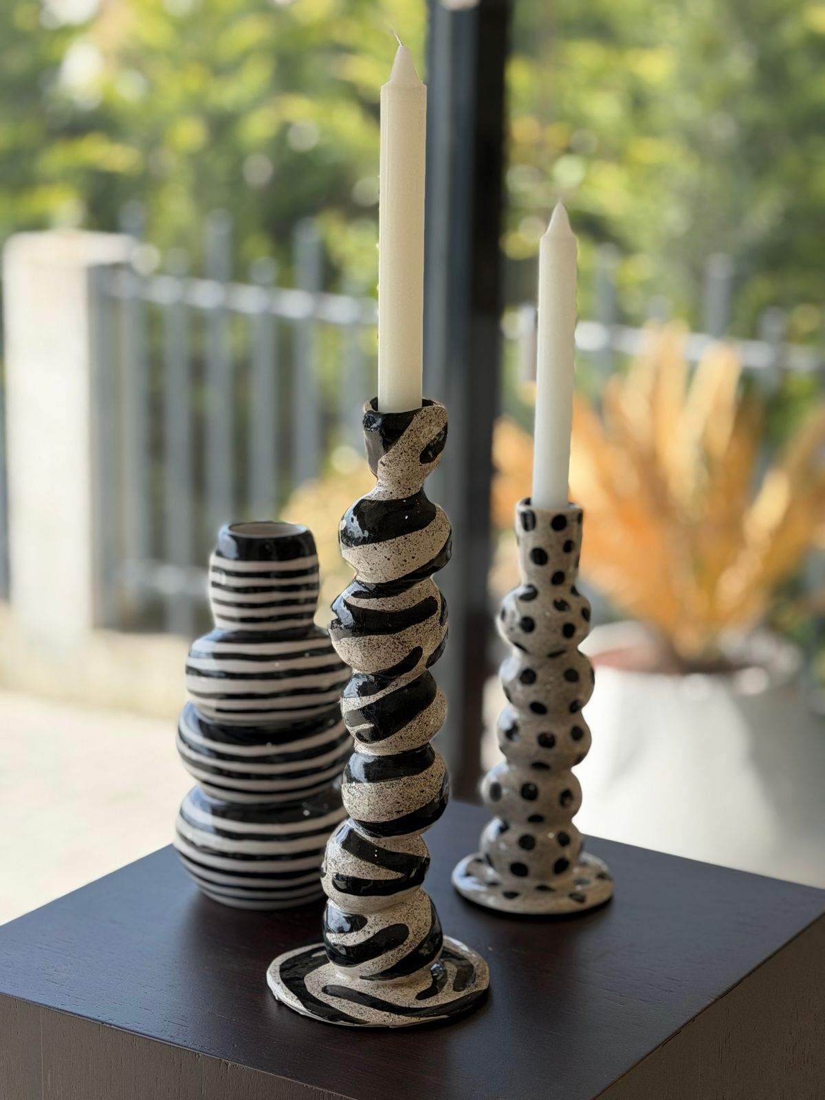 Dalmatian Candleholder — Sculptural candleholders in striped and spotted patterns.