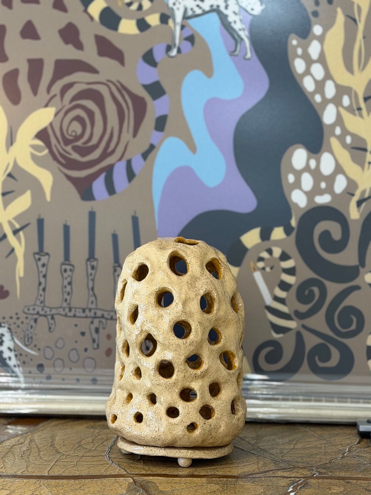 Perforated Ceramic Light — A ceramic light that scatters its glow through a perforated body.