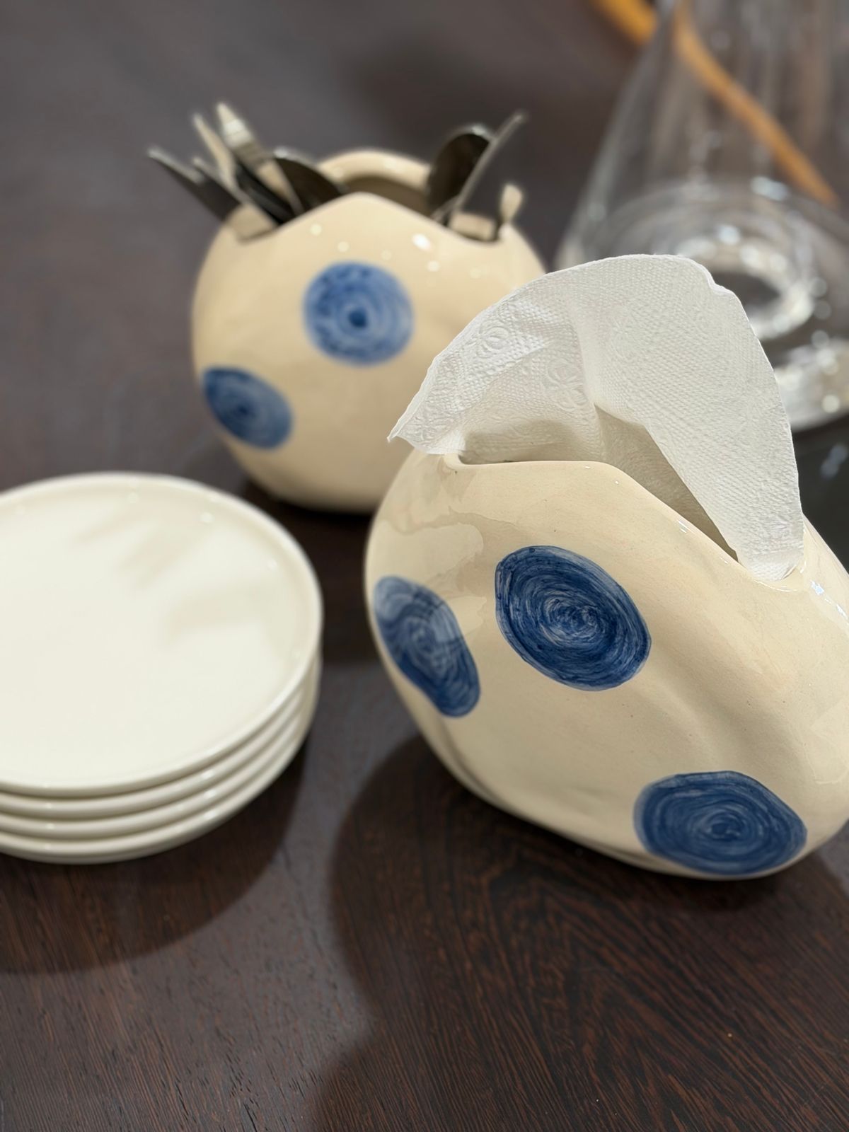 Blue Dot Napkin Holder — Napkin and cutlery holders with blue spiral dots.