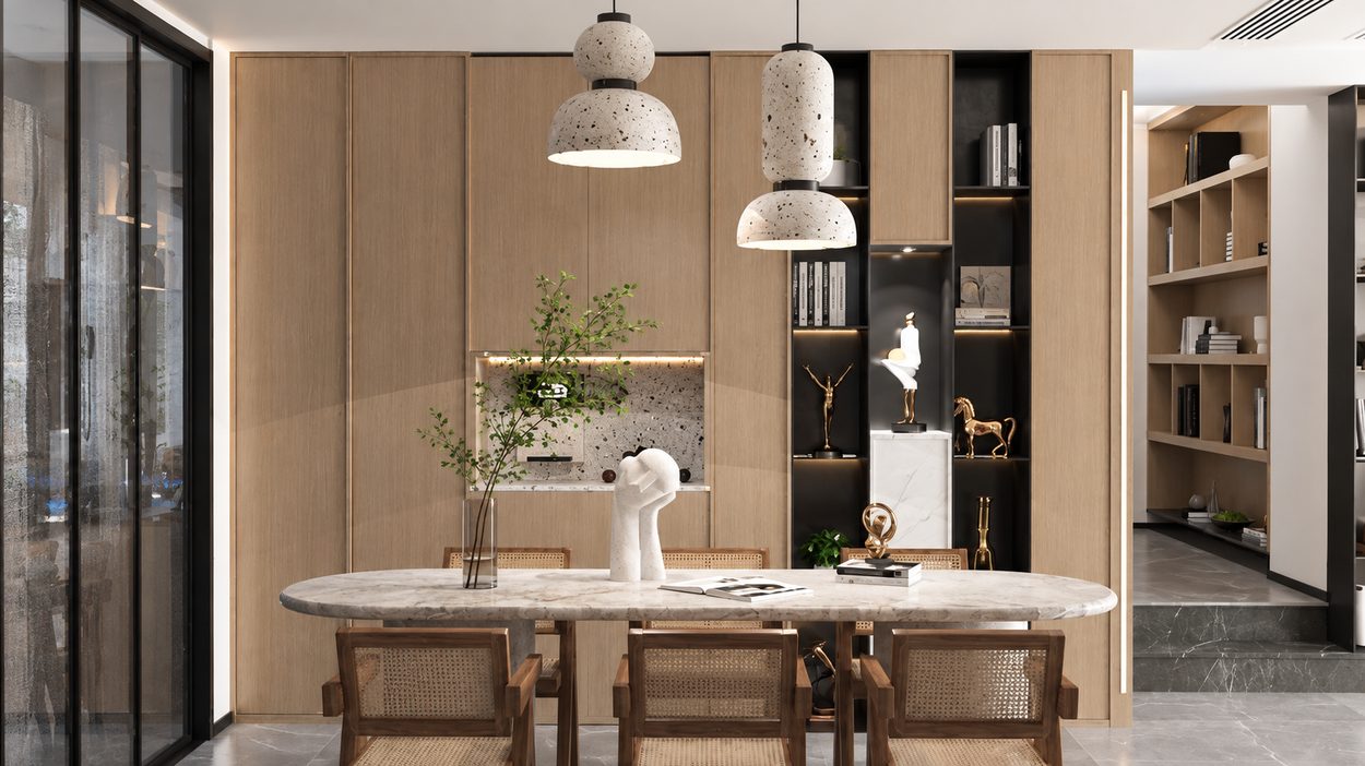 Closer view of the marble dining table, cane chairs and sculptural objects